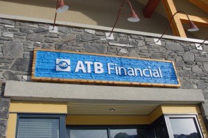 wood sign for bank company in Canmore